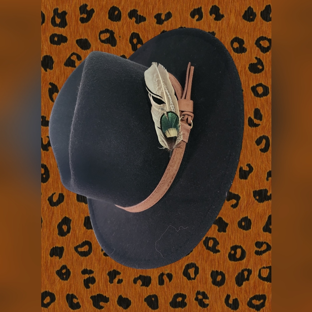 Black fedora with added feather